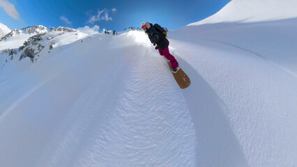 SELFIE: Woman with a big smile descends from the mountain on pristine whiteness