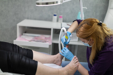 A method of performing pedicures involving the use of an electric nail cutter.
