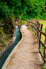 Hiking along the Marlinger Waalweg near Meran in South Tyrol Italy. With some Views over wineyards, the City of Meran, Marling and other Villages