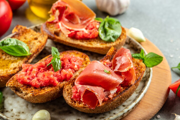 Toast with tomato and Olive oil and jamon ham, traditional Spanish breakfast