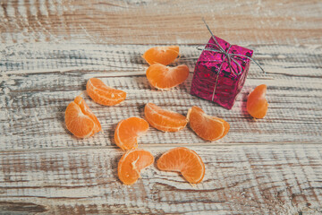 Fototapeta na wymiar New Year's toys and decorations, Christmas tree decorations, tangerines for the New Year