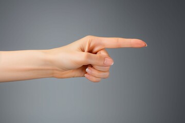 Disapproval signal Womans hand showing thumb down in studio isolation
