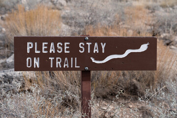 Reminder for hikers to stay on the trail due to rattlesnakes