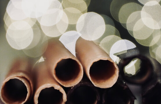 Neulas homemade on a plate typical thin biscuit rolls eaten at Christmas in Catalonia, Spain.


