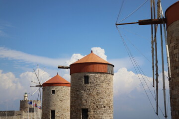 Windmills at the seafront in the city of Rhodes in Rhodes island in Greece