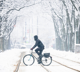 person riding bicycle in the snow