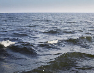 Fototapeta premium Water surface with waves and foam on the water surface of the sea