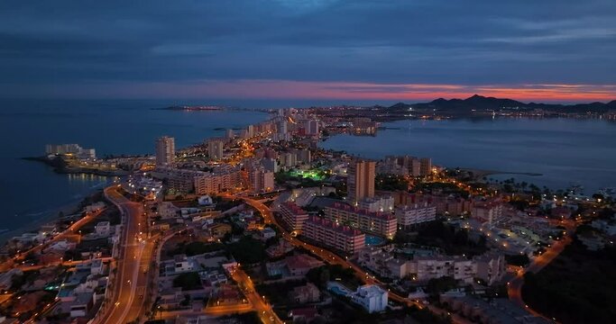 Establishing aerial shot of the city of manga, in La Manga del Mar Menor Murcia impressive view of the buildings and beaches. Spectacular travel destination La Manga