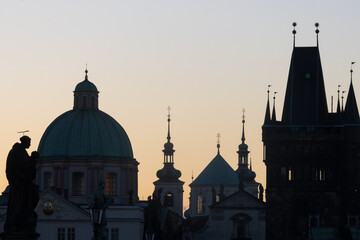 Fototapeta na wymiar Silhouette of Prague's towers at dawn.