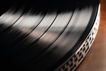 Classic vinyl record, turntable spin, analog sound, music. Vintage aesthetics.