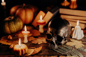 Mystique background - bronze human skull with candles. Visual gothic aesthetic.