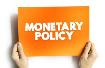 Monetary Policy - set of actions to control a nation's overall money supply and achieve economic growth, text concept on card
