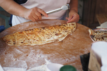 cooking turkish food. pita bread is cooked on the street. 