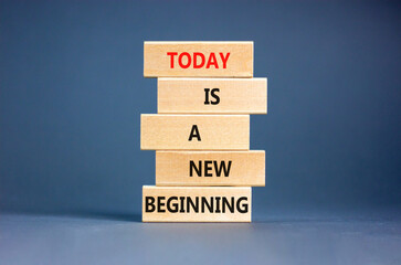 Today is a new beginning symbol. Concept words Today is a new beginning on wooden blocks. Beautiful...