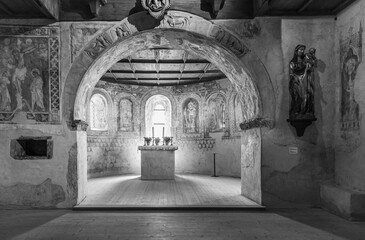 Tyrol Castle, Merano on South Tyrol, Trentino Alto Adige, Italy, June 14, 2023: interior of the Castle: lower chapel with Gothic wall paintings. Black and white image