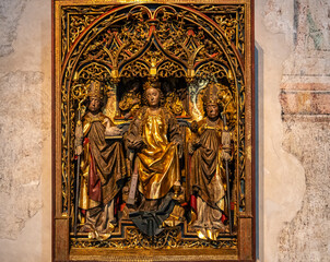 Tyrol Castle, Merano on South Tyrol, Trentino Alto Adige, Italy, June 14, 2023: interior of the Castle: wooden main altar in late Gothic style