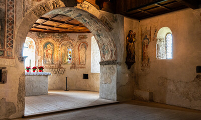 Tyrol Castle, Merano on South Tyrol, Trentino Alto Adige, Italy, June 14, 2023: interior of the Castle: lower chapel with Gothic wall paintings. Black and white image - obrazy, fototapety, plakaty