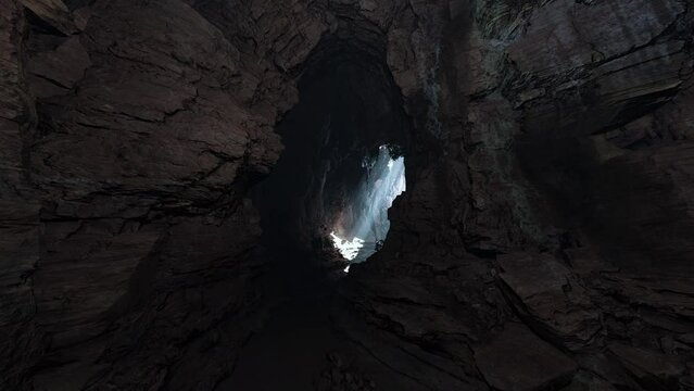 A cave filled with lots of rocks and water