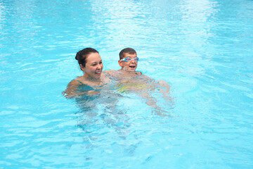 Joyful swim on a family holiday; the simplicity of joy. Highlights the preference for genuine, joyful family interactions.