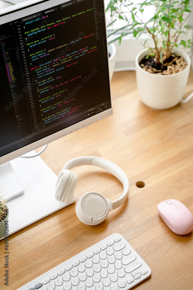 Canvas Prints html code on the screen of a white monitor standing on a wooden table with a keyboard, a coworking o