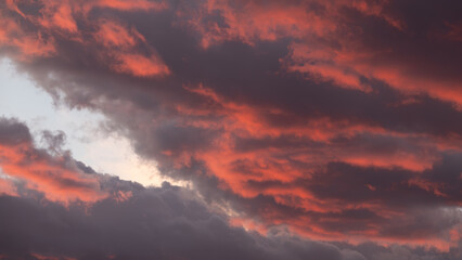 Dramatic sunset sky with red and orange clouds. Nature background.Daybreak or sunset time. 