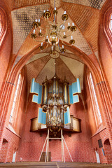 Ancient organ supported by beans results of earthquakes and gas extraction in medieval church of Zeerijp municipallity Midden-Groningen in Groningen province in The Netherlands - obrazy, fototapety, plakaty