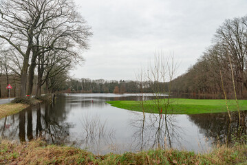 Fototapeta na wymiar Hattem, the Netherlands - December 27th, 2023: after weeks of heavy rainfall the local golf course is flooded.