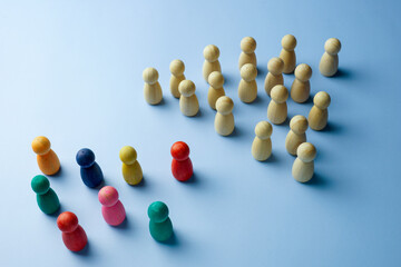 Crowd of figurines and colorful ones. Diversity concept.