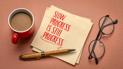 Slow progress is still progress - inspirational handwriting on a napkin, business and personal...