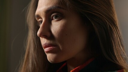 Portrait of attractive female model in negative mood. Close up shot brunette woman face in...