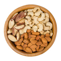 Wooden plate with almonds, cashews and brazil nuts. Isolated on white.
