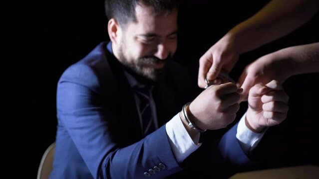 Wearing handcuffs is criminal.