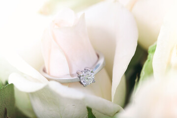 Engagement ring with diamond on rosebud