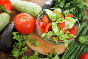Fresh vegetables on the wooden background