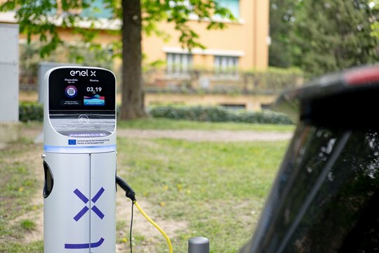 Electric car charger of Enel X company charging a battery vehicle