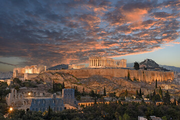 Panorama of Acropolis hill at night, Athens, Greece. Famous old Acropolis is a top landmark of Athens. Ancient Greek ruins in the Athens center at dusk - obrazy, fototapety, plakaty
