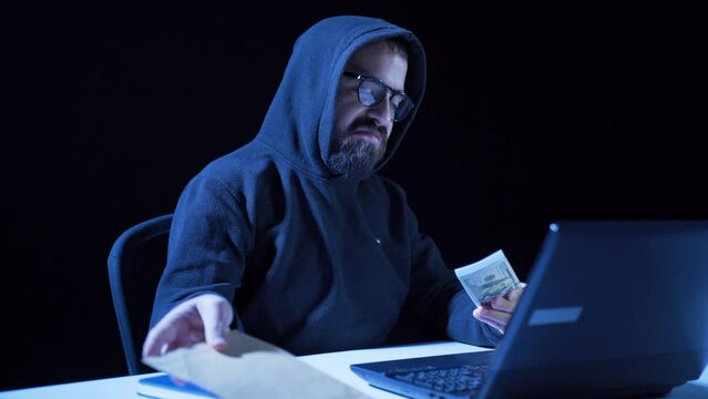 Hacker counting dirty money.