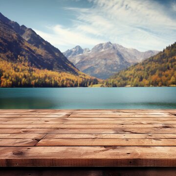 The empty wooden table top with blur background of summer lakes mountain. Exuberant image.