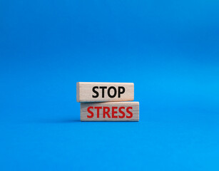 Stop Stress symbol. Concept word Stop Stress on wooden blocks. Beautiful blue background. Business and Stop Stress concept. Copy space