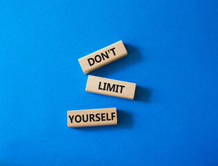 Do not limit yourself symbol. Concept words Do not limit yourself on wooden blocks. Beautiful blue background. Business and Do not limit yourself concept. Copy space
