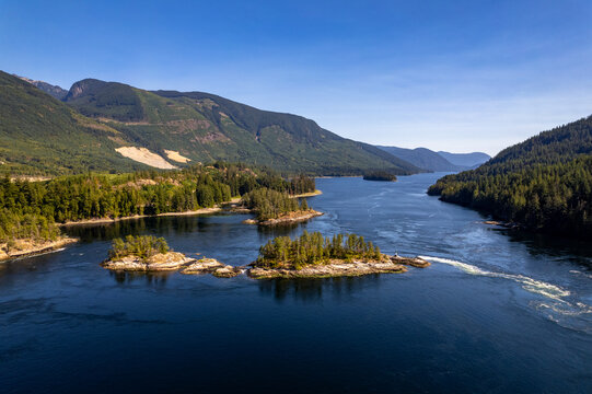 Skookumchuck Narrows with Sechelt Inlet in the Background. Sunshine Coast, British Columbia, Canada, during a pristine sunset. Aerial picture of the wild scenery. 