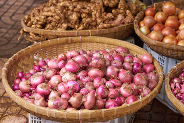 Naklejka na ściany i meble Red onions on the market in Vietnam.