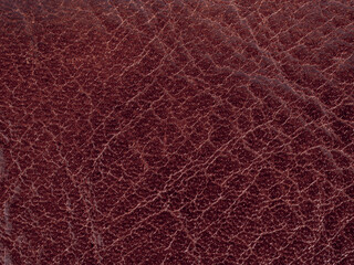 Texture of leather surfaces of buffalo leather material for sewing bags and clothes in red