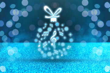 Christmas ball made of music notes and snowflakes against blue background. Bokeh effect