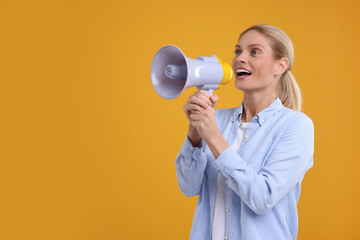 Special promotion. Woman shouting in megaphone on orange background. Space for text