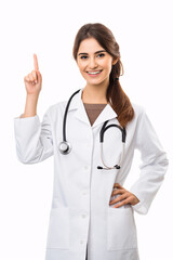 Portrait of a young doctor in a white coat on a white background.