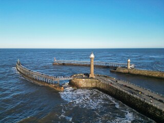 Whitby harbour, lighthouse, coastal landscape, drone image, landscape, sky, horizon, blue sky,...