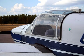 Fototapeta na wymiar Finnish Aerodrome Serenity: Parked Light Aircraft in Nummela