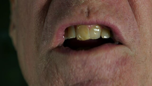 Close up of a man's mouth while ranting