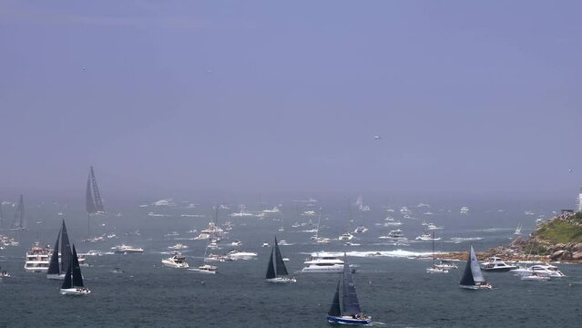South head of Sydney Harbour at yacht race to Hobart with yachts and boats 4k.
